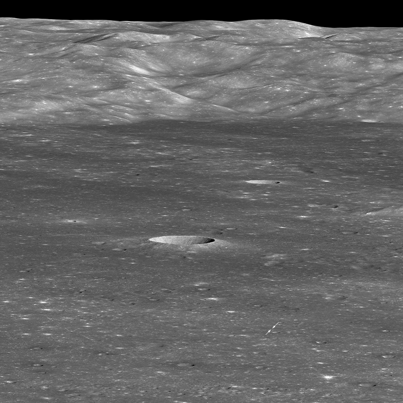 The Chang’e 4 landing site indicated by two white arrows.